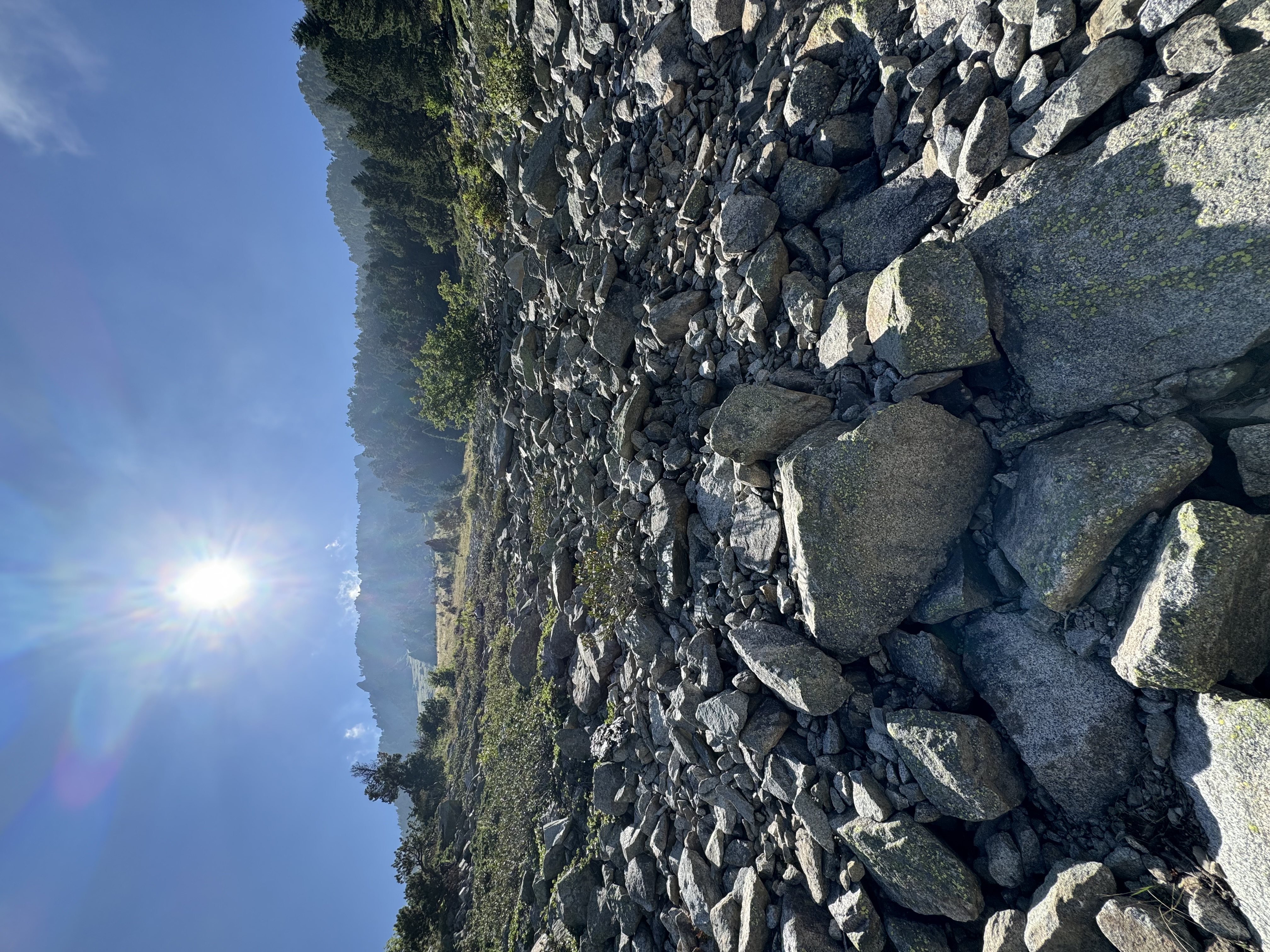 Rocky mountain terrain under sunlight